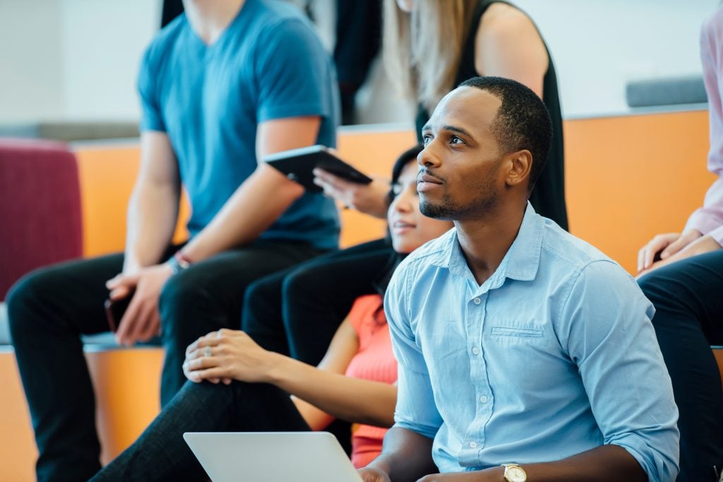 Group of people enjoying a lecture in a modern auditorium